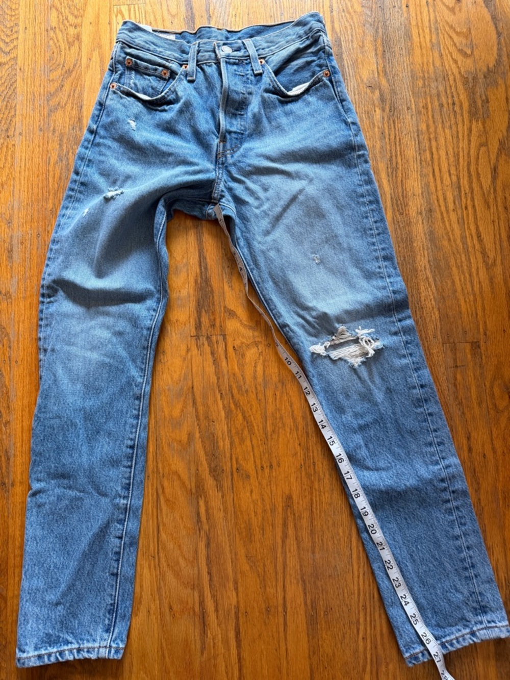Levi's Straight Leg Jeans in Light Blue with Distressed Knee